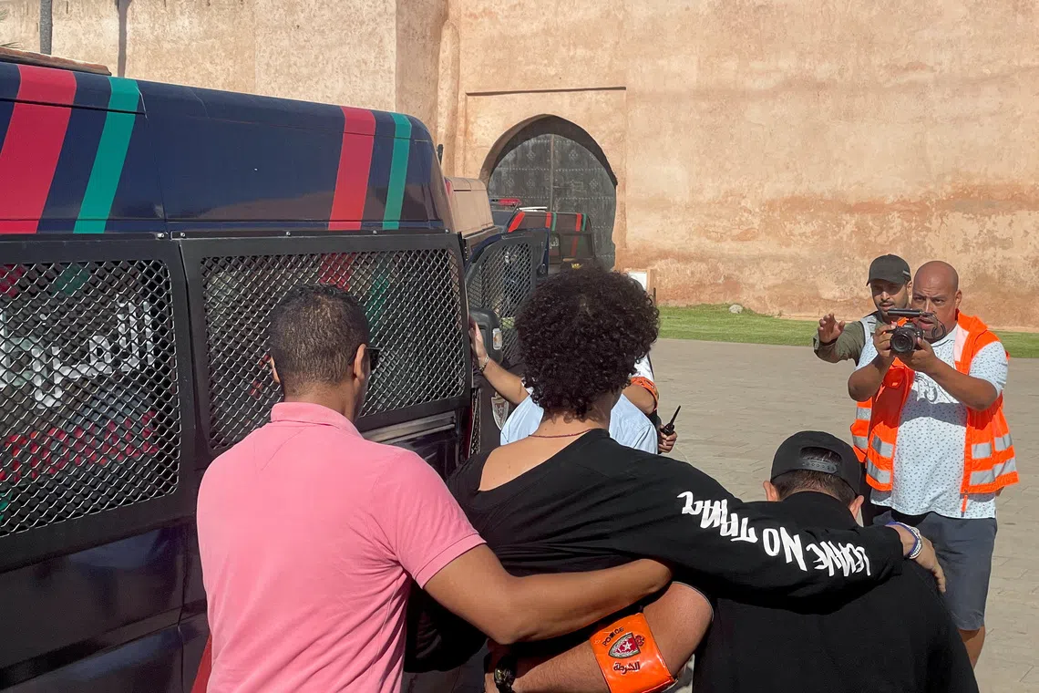 Police officers detain a young man who wanted to protest for better healthcare and education services, in Rabat, Morocco September 28, 2025. REUTERS/Ahmed El Jechtimi
