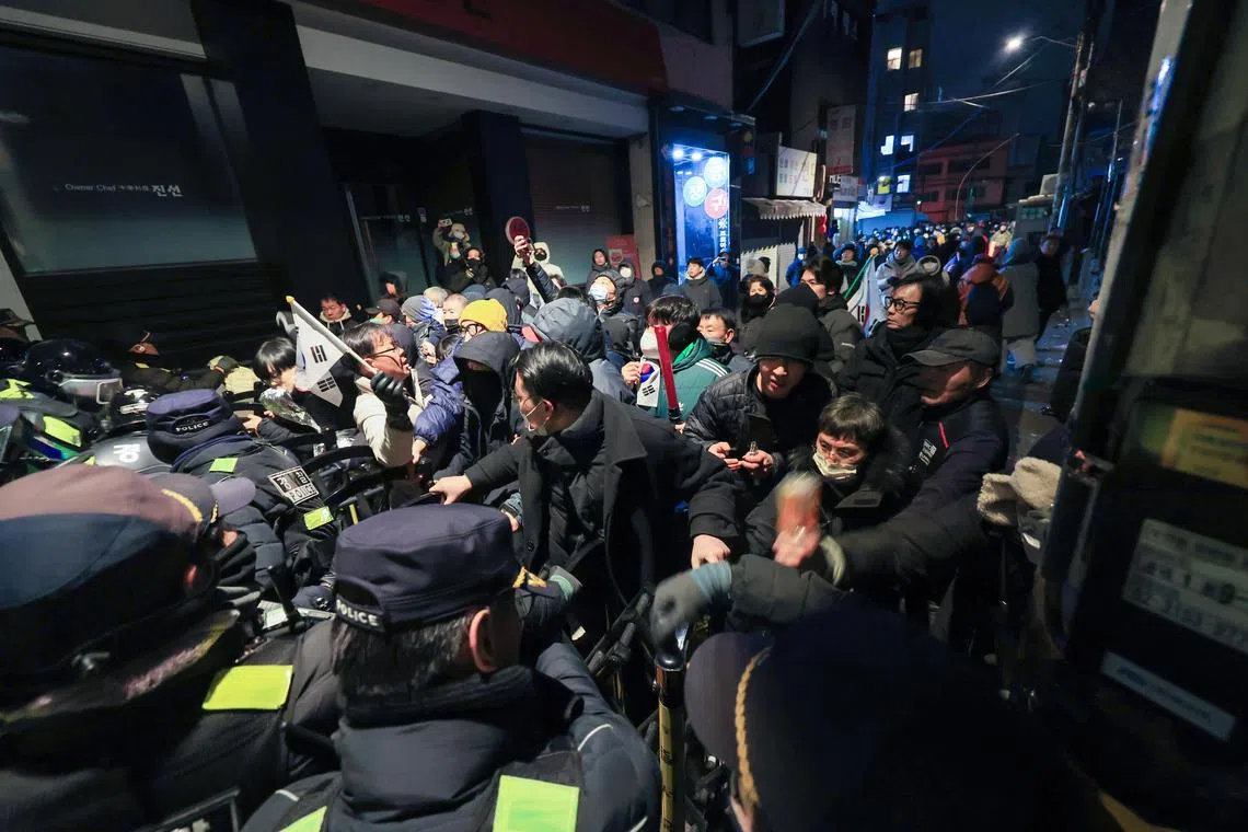 Police officers try to break up a crowd of supporters of suspended President Yoon Suk Yeol in front of the Seoul Western District Court in Seoul, South Korea on Jan 19, 2025.