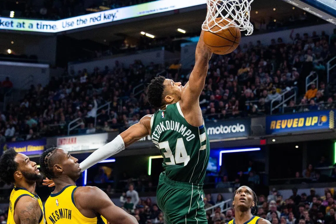 Milwaukee Bucks forward Giannis Antetokounmpo dunks the ball during the 141-131 win over the Indiana Pacers.
