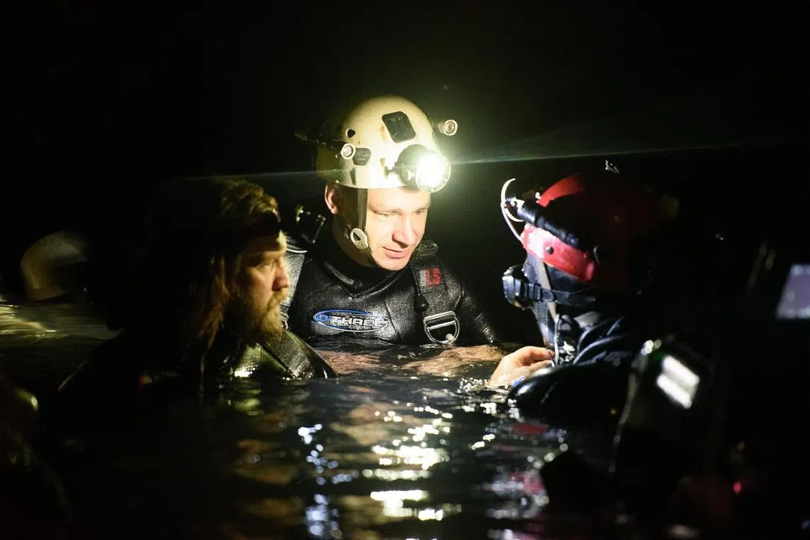Erik Brown (left) with fellow divers trying to rescue 12 boys and their football coach out of the Tham Luang Nang Non cave complex in Thailand.