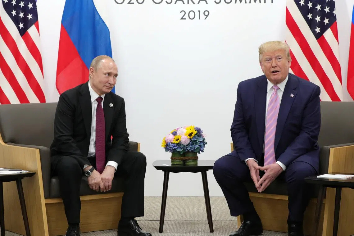 FILE PHOTO: Russia's President Vladimir Putin and U.S. President Donald Trump attend a meeting on the sidelines of the G20 summit in Osaka, Japan June 28, 2019. Sputnik/Mikhail Klimentyev/Kremlin via REUTERS/File Photo