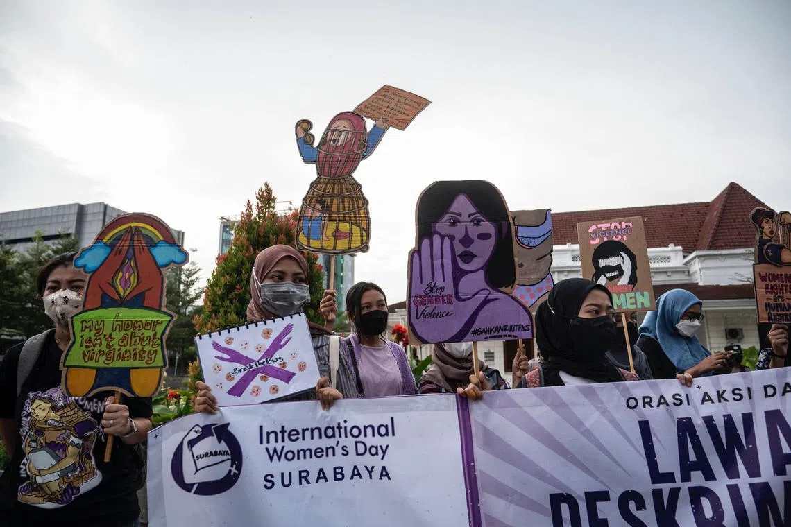Activists take part in a demonstration for better women's rights on International Women’s Day in Surabaya on March 8, 2022.