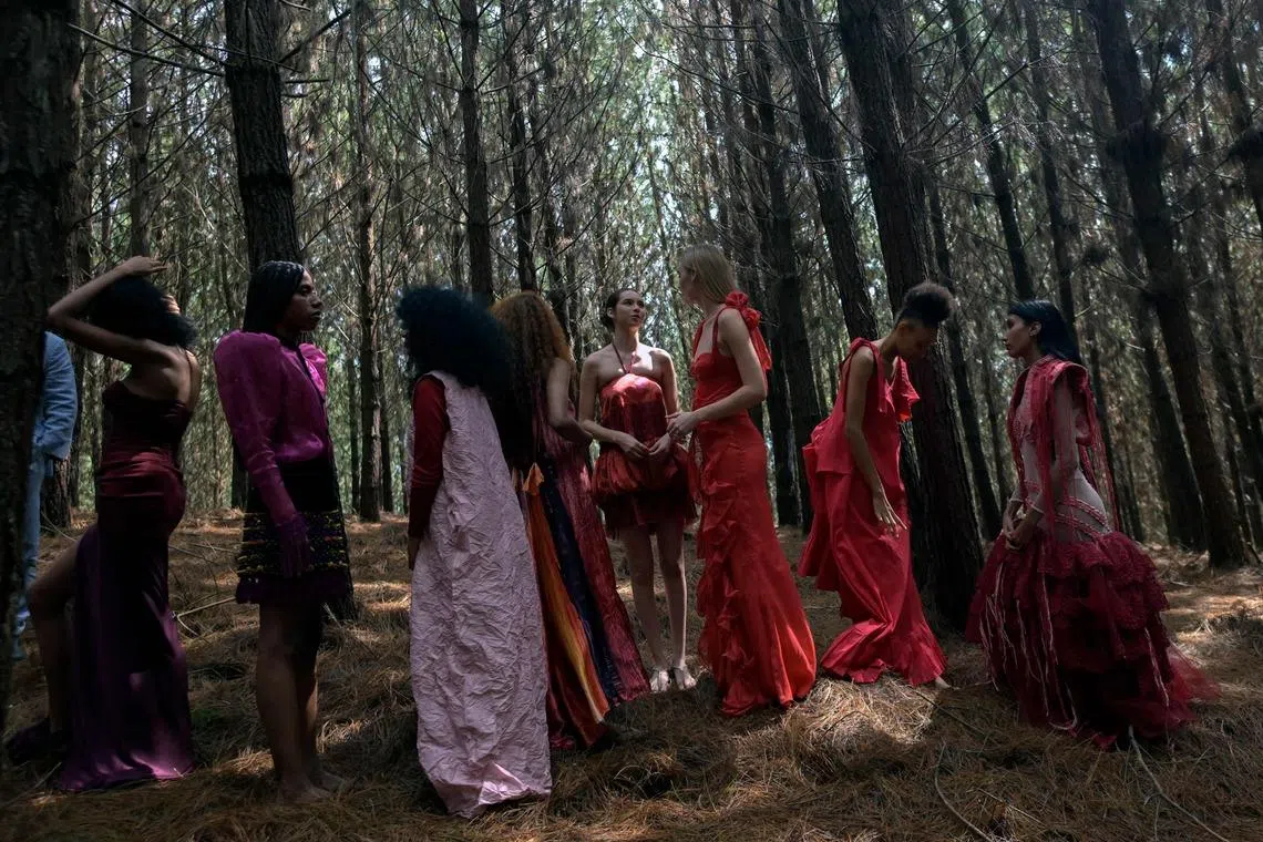 TOPSHOT - Models wait backstage before presenting creations by some of the designers taking part in the Cali Distrito Moda fashion fair during a launch runway show in La Cumbre, Valle del Cauca department, Colombia, on May 6, 2026. The Cali Distrito Moda fashion fair will take place between June 11 and June 13. (Photo by JOAQUIN SARMIENTO / AFP)