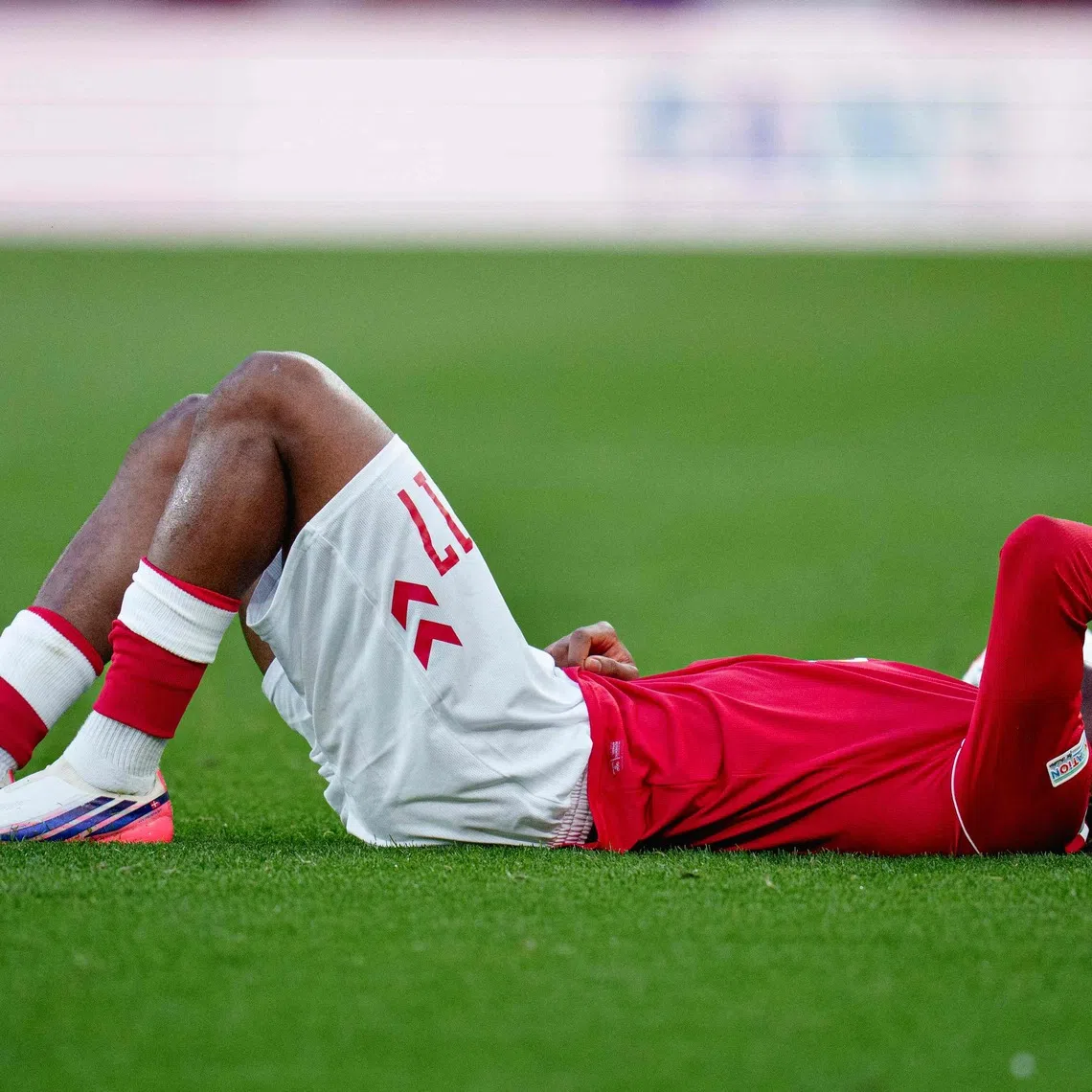 Manchester United’s Patrick Dorgu was forced off during the first half, appearing to hold the back of his thigh.