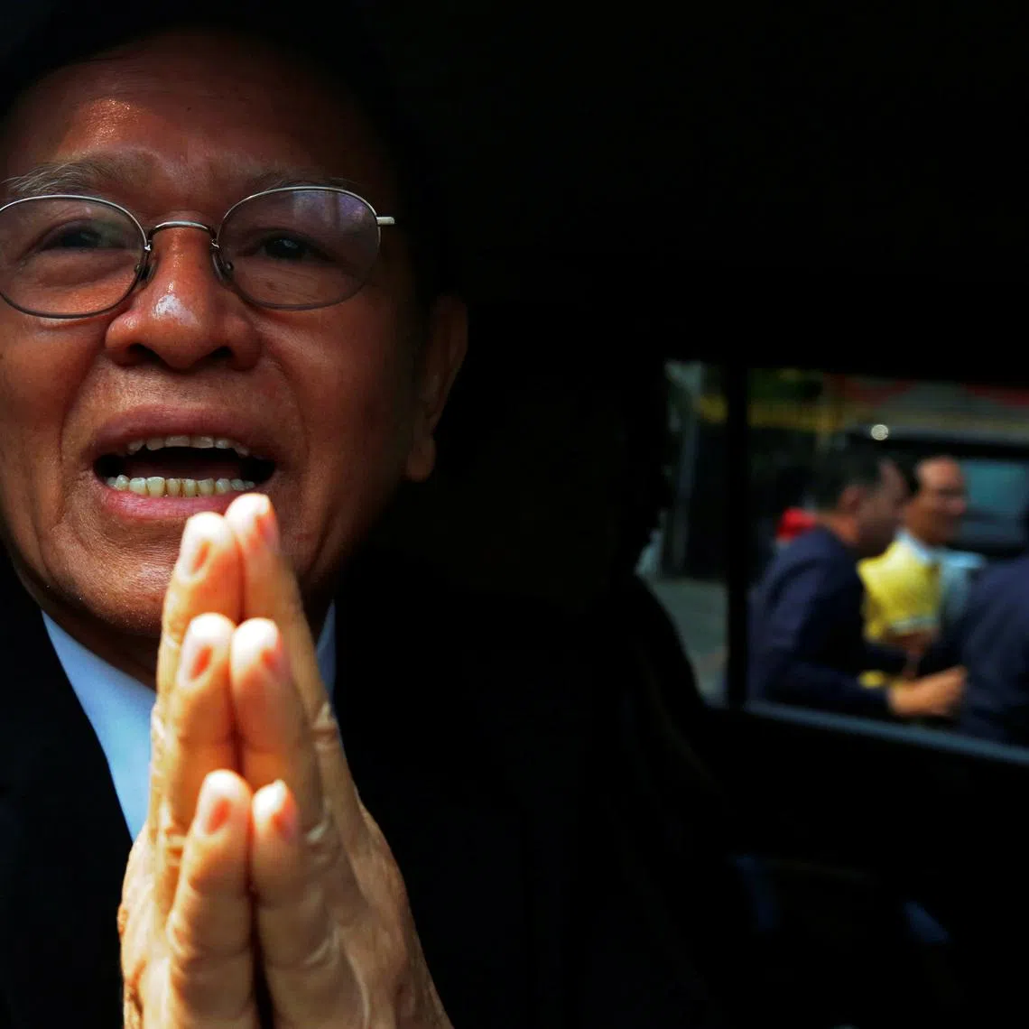 FILE PHOTO: Cambodian opposition leader Kem Sokha greets as he leaves the Municipal Court of Phnom Penh, Cambodia January 16, 2020. REUTERS/Samrang Pring/ File Photo