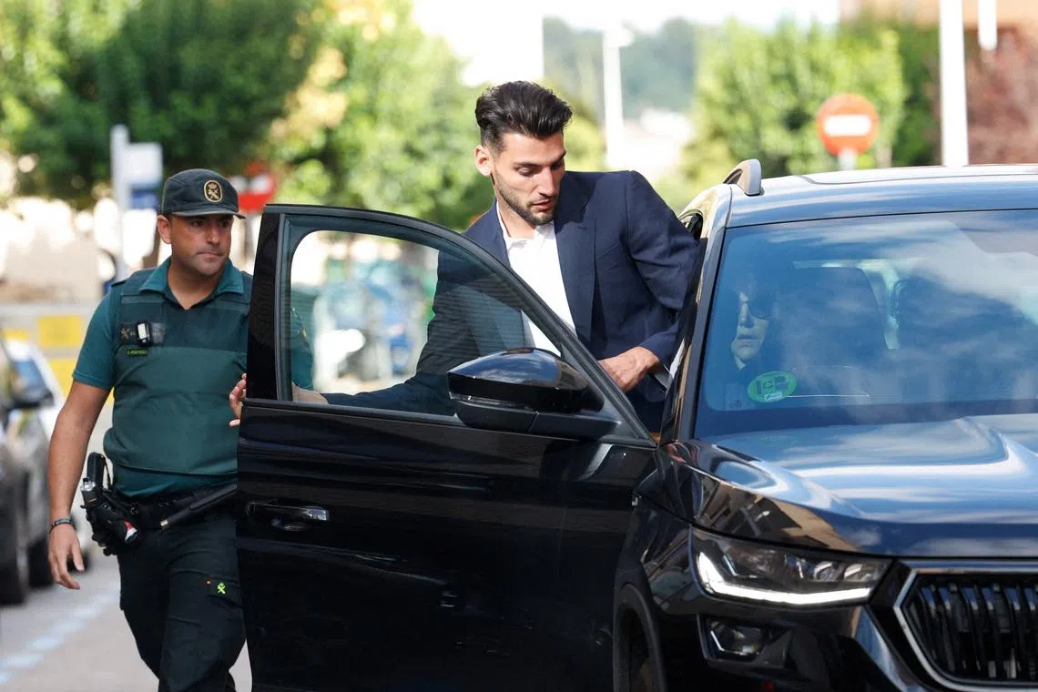 FILE PHOTO: Valencia football player Rafa Mir leaves a Valencia local court after a judge released him with precautionary measures for an alleged crime of sexual assault, in Liria, Spain, September 4, 2024. REUTERS/Eva Manez/File Photo