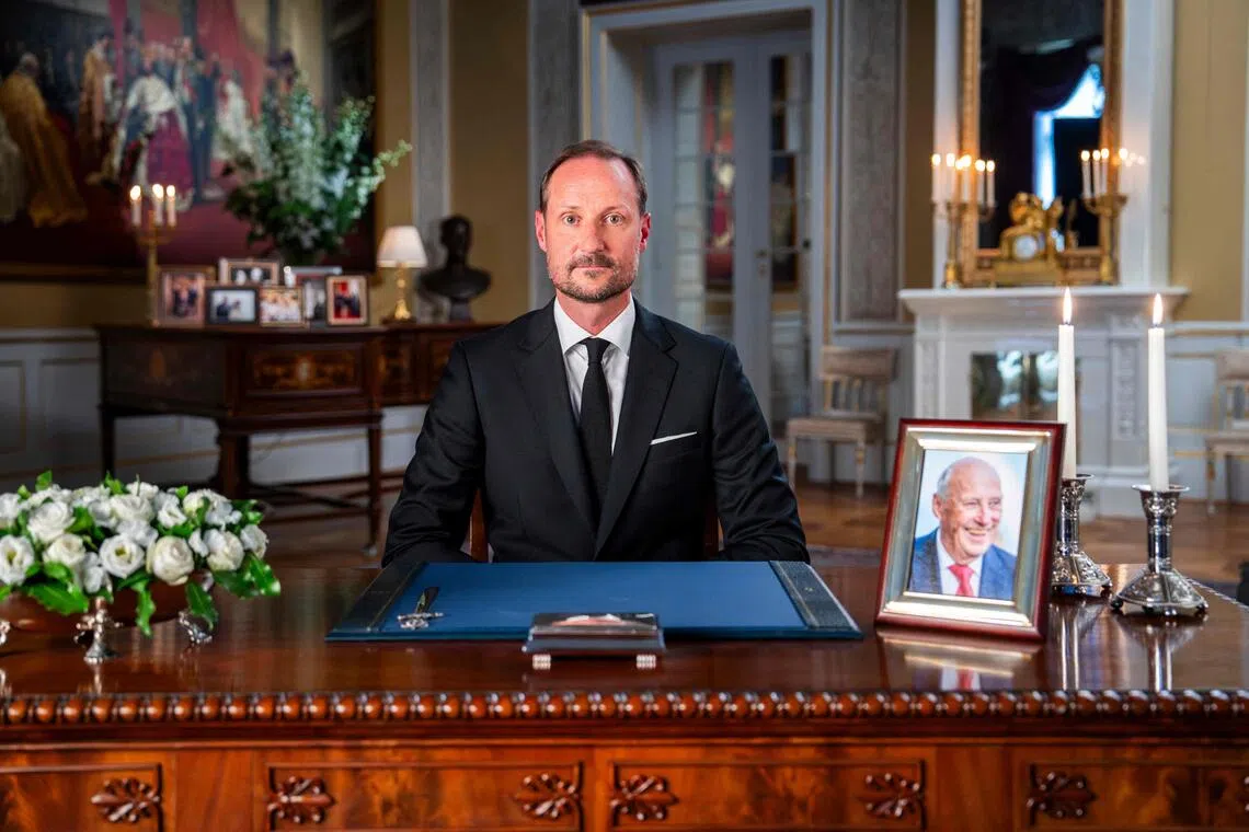 Norway’s King Haakon VIII making his first speech to the nation at the Royal Palace in Oslo on Aug 29, with a portrait of his late father, King Harald, to his left.