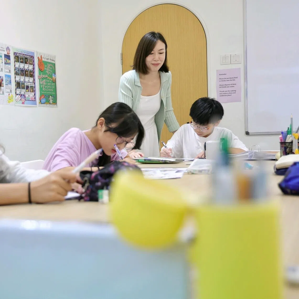 Delia Siow, head of Primary English Curriculum at Lil’ but Mighty English tuition centre, at a class for Primary 6 pupils at Bukit Timah Shopping Centre on June 8.
