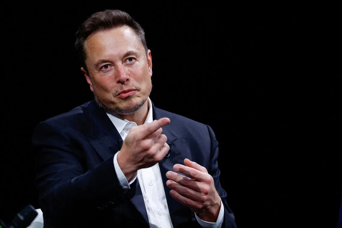 FILE PHOTO: FILE PHOTO: Elon Musk, Chief Executive Officer of SpaceX and Tesla and owner of X, formerly known as Twitter,  gestures as he attends the Viva Technology conference dedicated to innovation and startups at the Porte de Versailles exhibition centre in Paris, France, June 16, 2023. REUTERS/Gonzalo Fuentes/File Photo