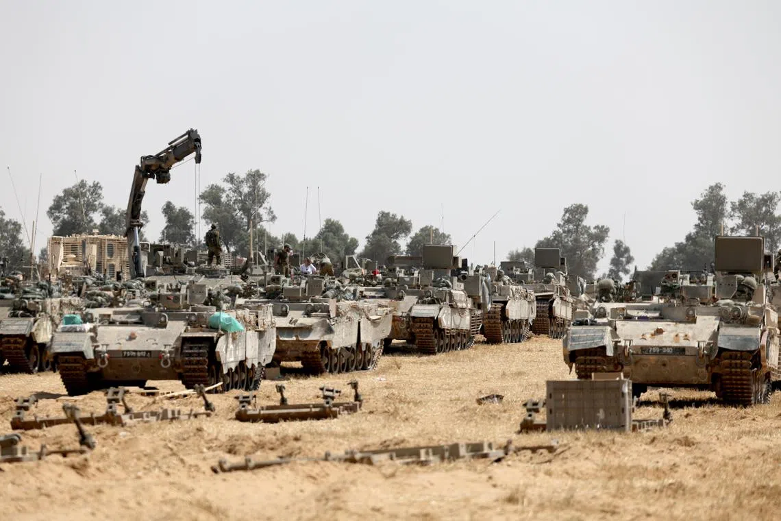 Israeli soldiers gather at a position on the southern Israeli border with the Gaza Strip, near the Palestinian city of Rafah on May 1.