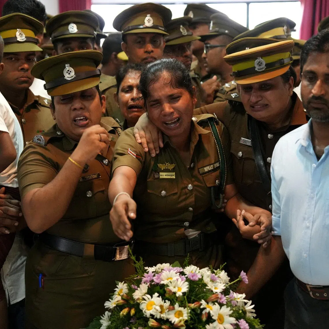 The seven prison officials and 19 prisoners died in two days of fighting between two groups of inmates at the prison in the coastal town of Negombo.