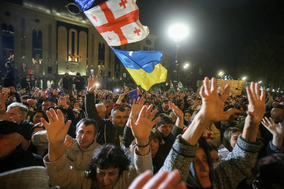 Supporters of Georgia's opposition parties hold a rally to protest and dispute the result of a recent parliamentary election won by the ruling Georgian Dream party, in Tbilisi, Georgia October 28, 2024. REUTERS/Irakli Gedenidze/File Photo