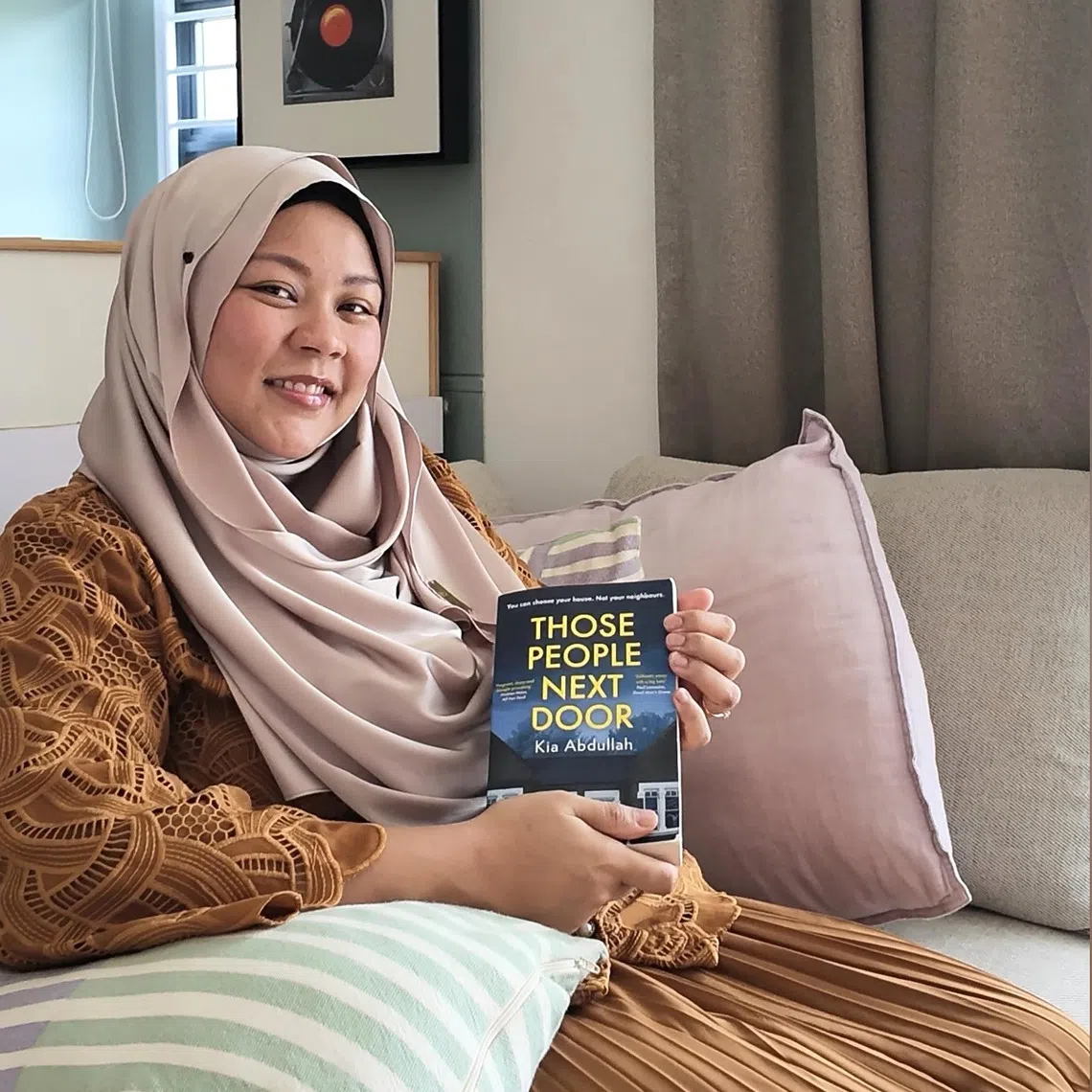 Digital content creator Shamsydar Ani loves reading on the sofa in her living room.