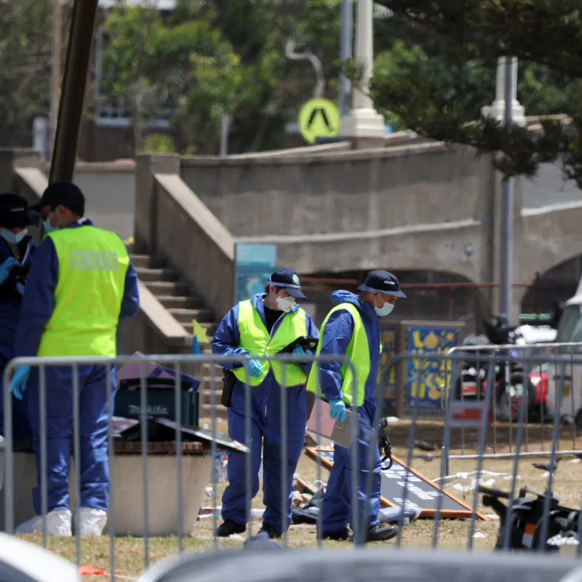 Members of the forensic team work at the scene of a shooting during a Jewish holiday celebration at Bondi Beach, in Sydney, Australia, December 15, 2025. REUTERS/Hollie Adams