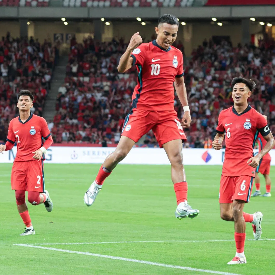 Faris Ramli, flanked by Irfan Najeeb (left) and Shah Shahiran, jumping for joy after making it 2-0 against Thailand in the 2024 ASEAN Championship before the Thais came back to win 4-2.