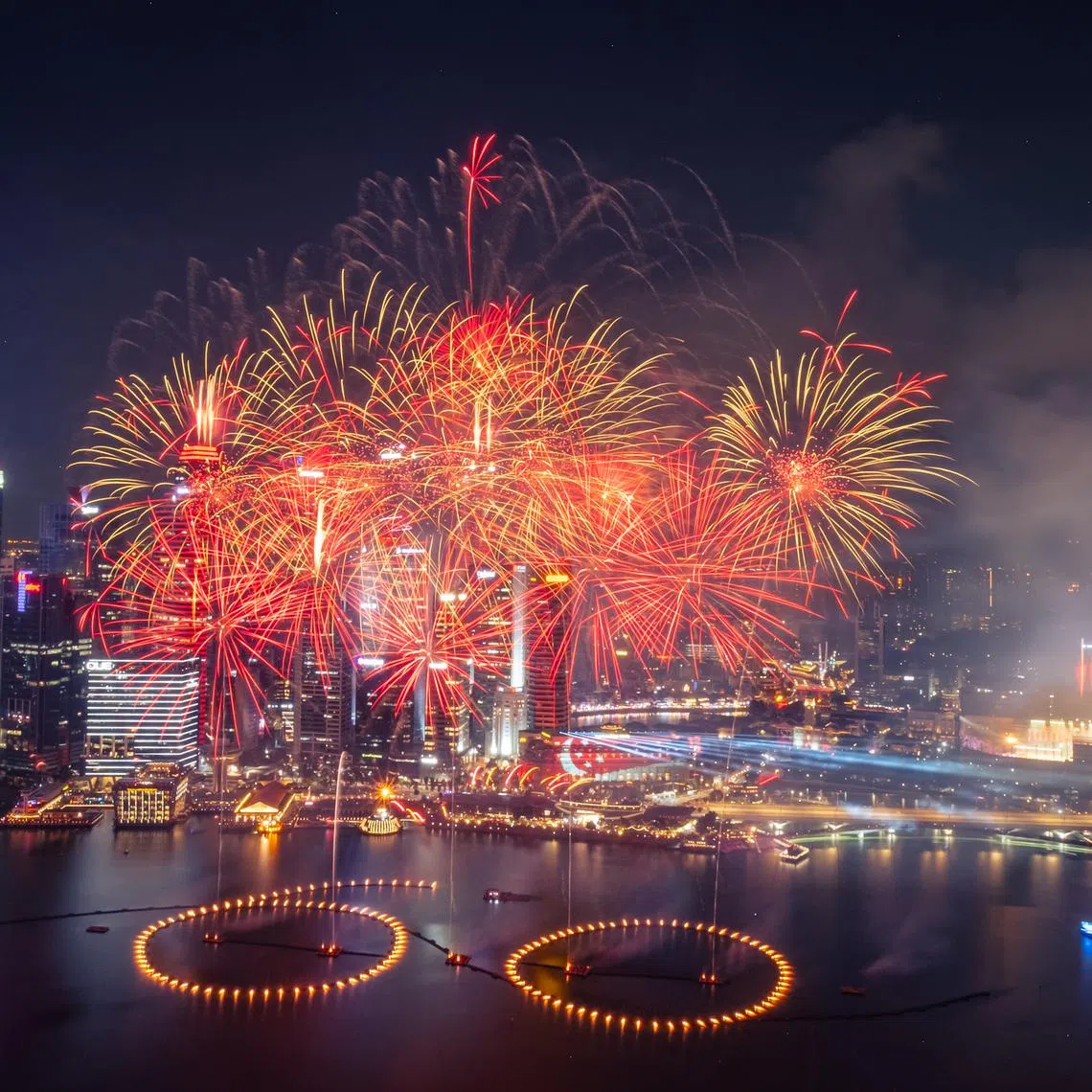 Fireworks illuminating the night sky above the Padang and Marina Bay during the National Day Parade on Aug 9.