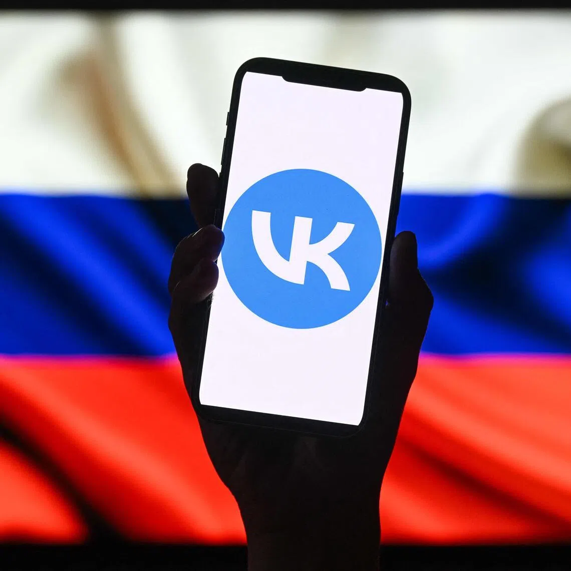 This illustration photograph shows the logo of Russian social media platform VK displayed on a smartphone in Moscow on June 25, 2026. Apple has removed VKontakte, one of Russia's largest social networks, from its App Store, the Russian company said on June 25, 2026, with the Kremlin calling for an explanation from the California-based tech giant. VKontakte (VK) was launched in 2006 as Russia's answer to Facebook and has since grown to become one of the most popular websites and social media platforms in the country. (Photo by Igor IVANKO / AFP)