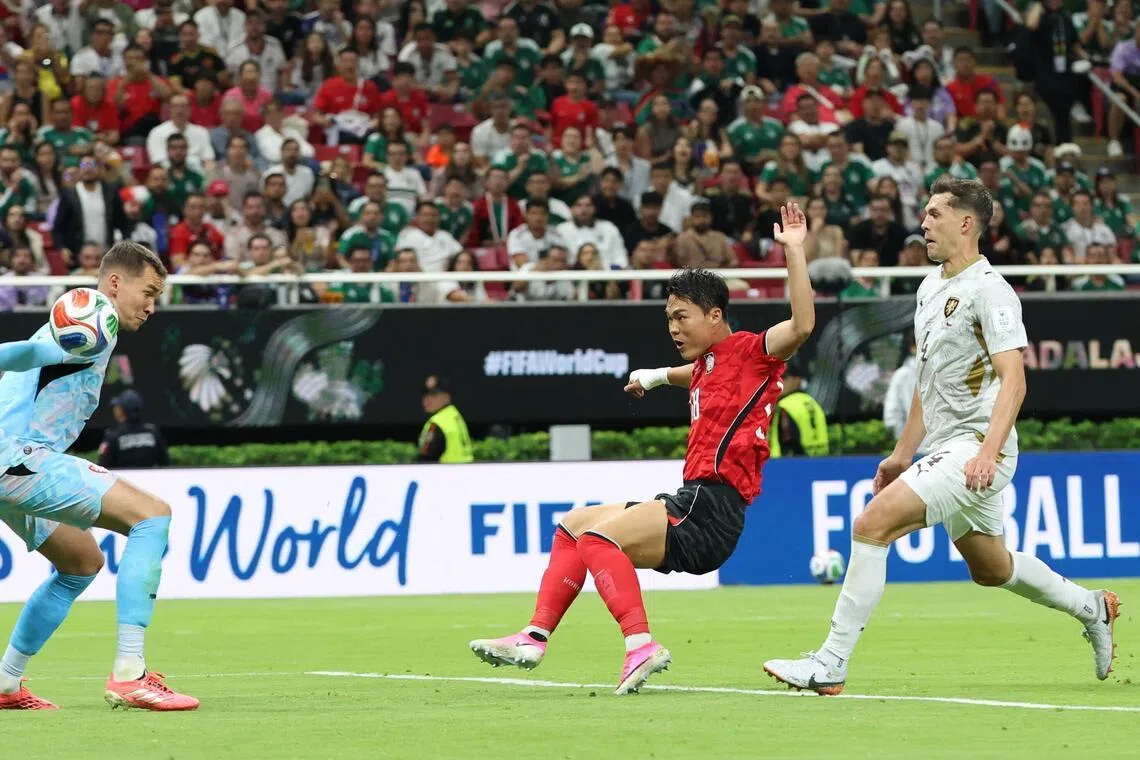 South Korea's Oh Hyeon-gyu (centre) scoring the team's second goal against the Czechs on June 11.