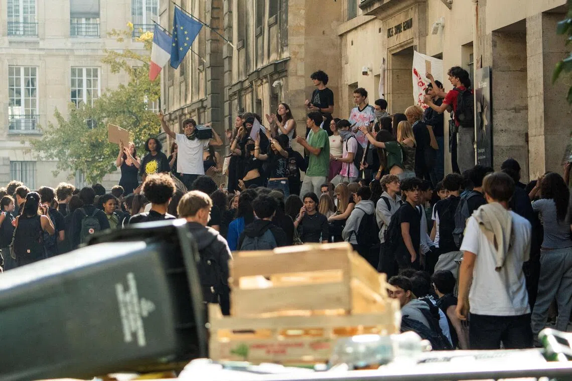 French high school students gather as part of nationwide protests voicing anger over overcrowded classrooms, teacher shortages, and dilapidated school buildings.