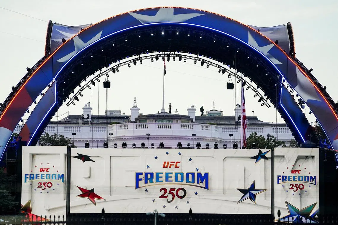 Security personnel stand atop the White House ahead of the ceremonial weigh-ins for fighters participating in UFC Freedom 250, at the Ellipse near the White House, in Washington, D.C., U.S., June 13, 2026. REUTERS/Nathan Howard