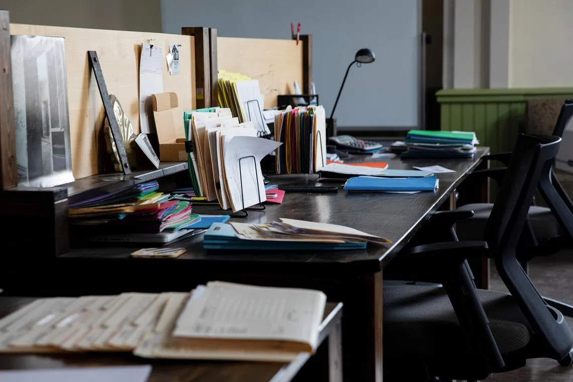 FILE PHOTO: Desks sit empty inside the Grand Army of the Republic Building as employees continue to work remotely due to the coronavirus disease (COVID-19) pandemic in Detroit, Michigan, U.S., June 8, 2021. REUTERS/Emily Elconin/File Photo