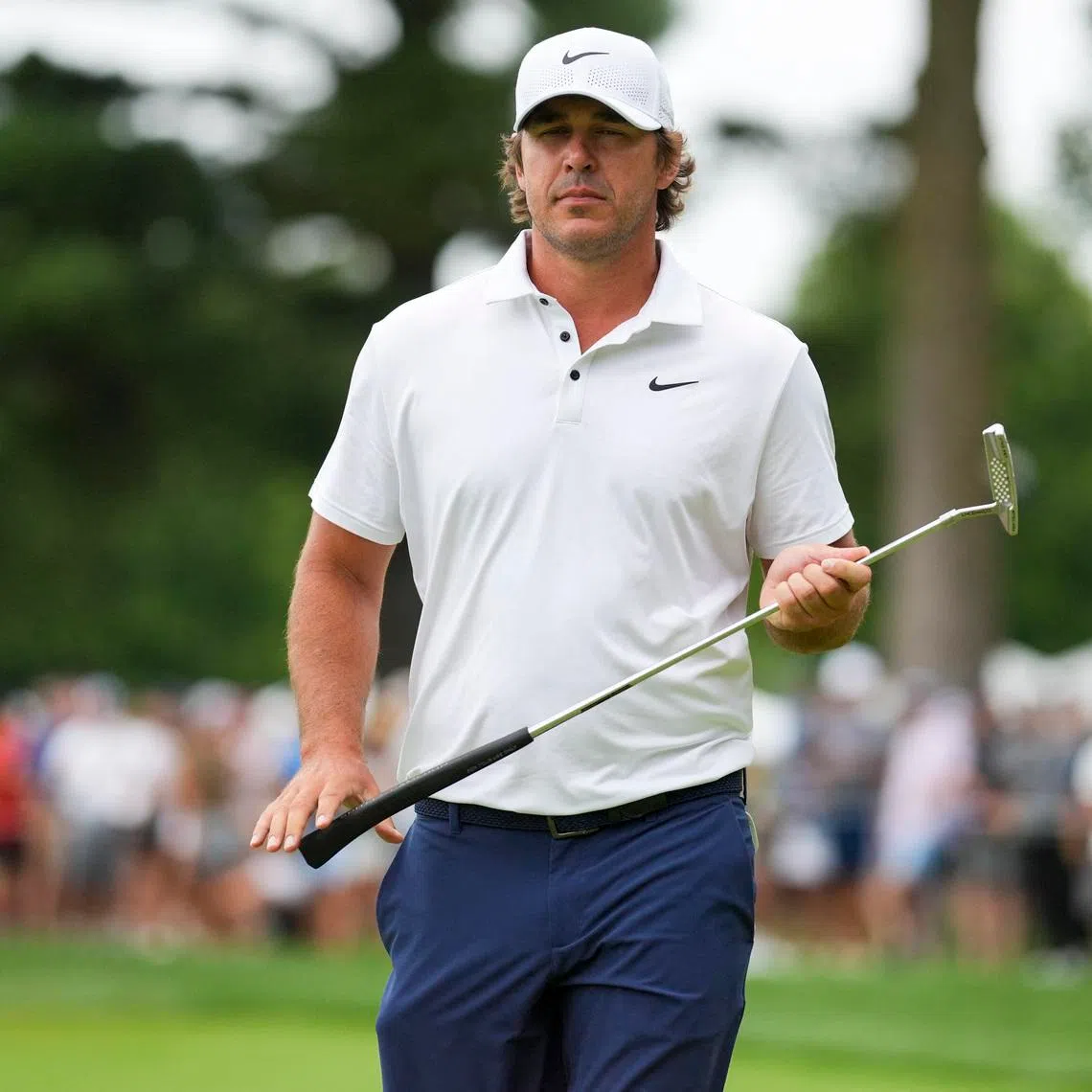 Aug 23, 2025; Detroit, Michigan, USA;  Brooks Koepka of Smash GC lines up a putt on the 17th green during the semifinals of the LIV Golf Michigan Team Championship at The Cardinal at Saint John's Resort. Mandatory Credit: Aaron Doster-Imagn Images