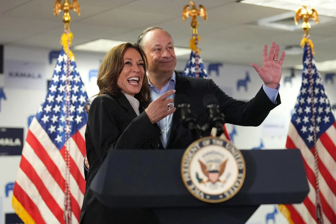 US vice-president and Democratic presidential candidate Kamala Harris, and Second Gentleman Doug Emhoff acknowledge the crowd before Ms Harris spoke at her campaign headquarters in Wilmington, Delaware, on July 22.