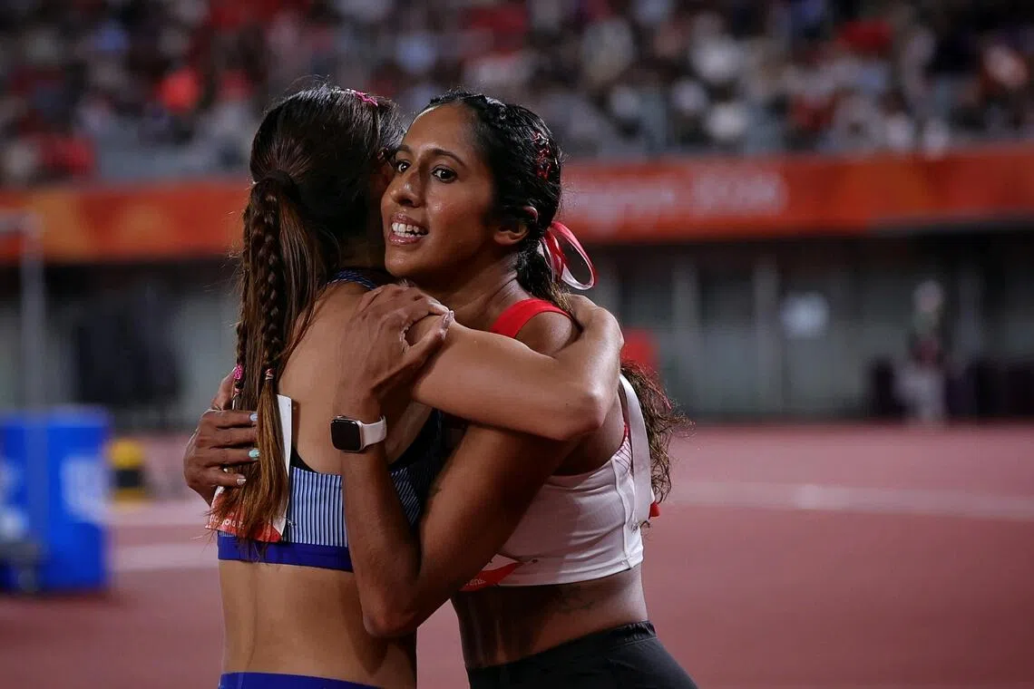 Shanti Pereira of Singapore hugging Liao Yan-jun of Taiwan after the Asian Games athletics women’s 100m semi-final at the Paloma Mizuho Stadium in Nagoya, Japan on Sept 25.