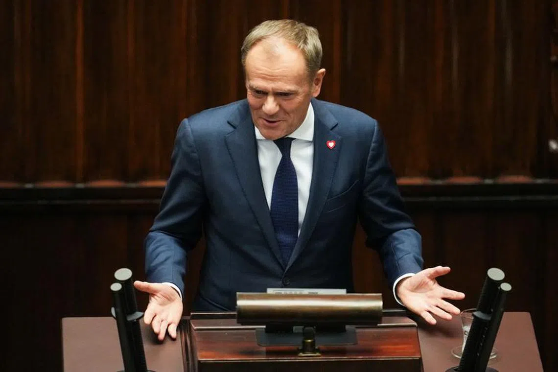 Newly appointed Polish Prime Minister Donald Tusk speaks during a parliament session, in Warsaw, Poland December 12, 2023. REUTERS/Aleksandra Szmigiel