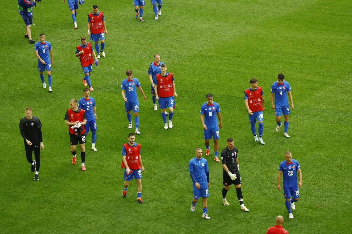 Soccer Football - Euro 2024 - Group E - Slovakia v Ukraine - Dusseldorf Arena, Dusseldorf, Germany - June 21, 2024 Slovakia players look dejected after the match REUTERS/Piroschka Van De Wouw