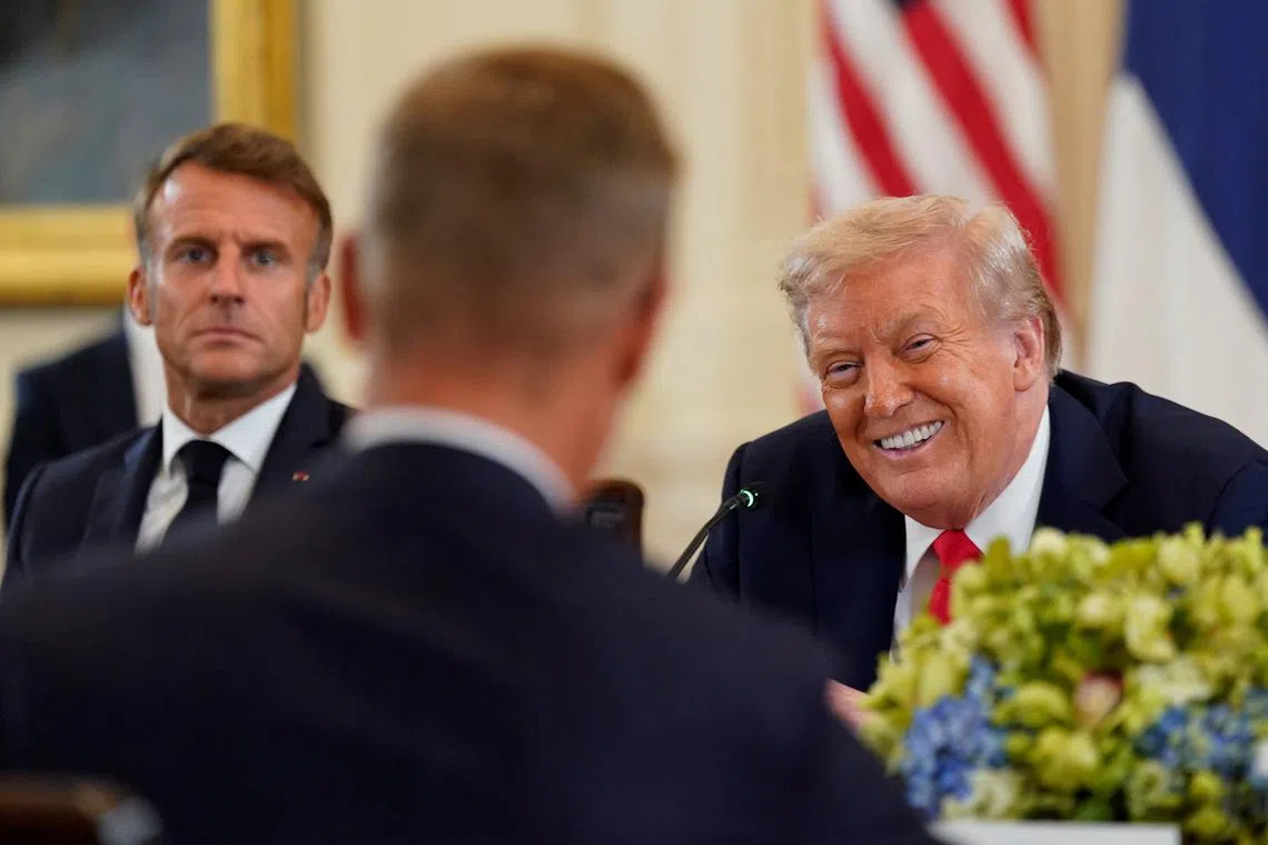 U.S. President Donald Trump meets French President Emmanuel Macron and Finland's President Alexander Stubb, amid negotiations to end the Russian war in Ukraine, at the White House in Washington, D.C., U.S., August 18, 2025. REUTERS/Al Drago