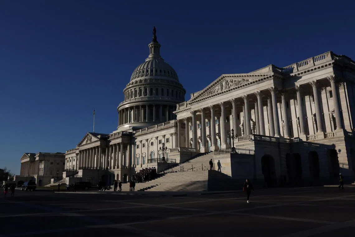 People walk past the U.S. Capitol building in Washington, U.S., January 11, 2024. REUTERS/Leah Millis/FILE PHOTO