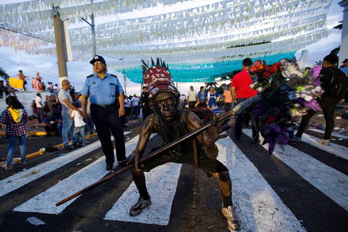 A man covered with motor oil takes part in celebrations on Aug 1, 2023, honouring the patron saint of Managua, St. Dominic de Guzman, the largest celebration in the Central American country after Nicaragua's government allowed the popular festivities.