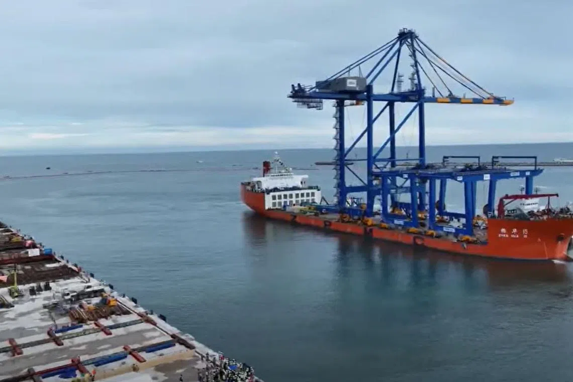 Zhen Hua 15 – a heavy load cargo carrier sailing from the East China sea – unloads at Vizhinjam port on Sunday.