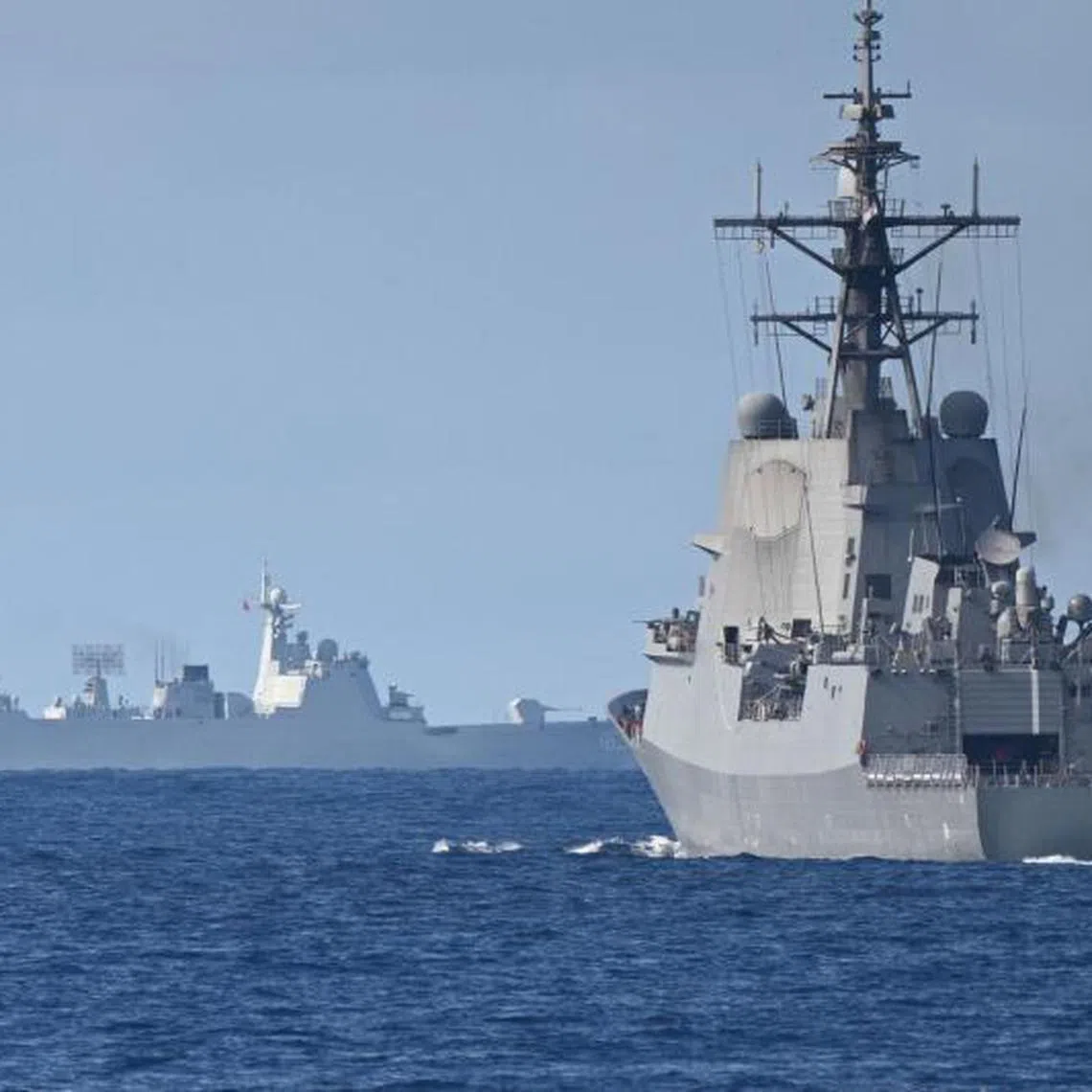 A Chinese PLA Navy ship (left) is seen with the Royal Australian Navy destroyer HMAS Brisbane participating in a maritime exercise near Scarborough Shoal in the disputed South China Sea on Sept 3.