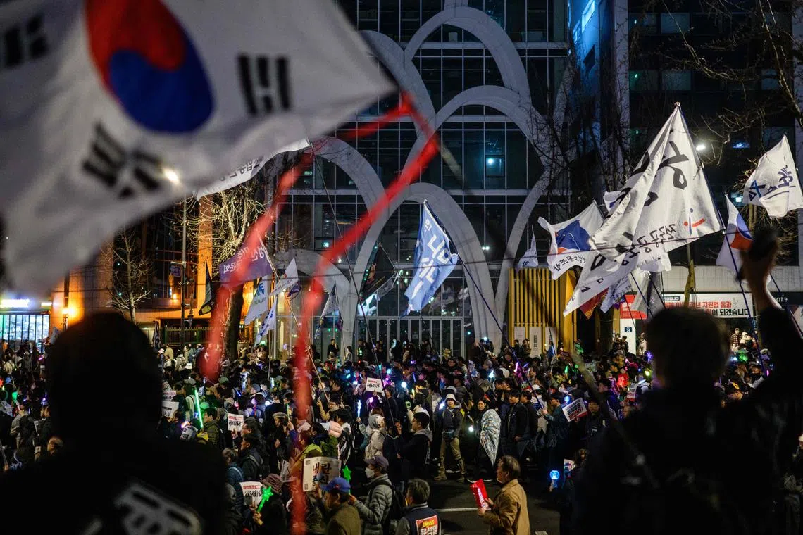 Anti-Yoon protesters march at a rally in Seoul on March 15, 2025, ahead of the impeachment verdict for South Korean president Yoon Suk Yeol.