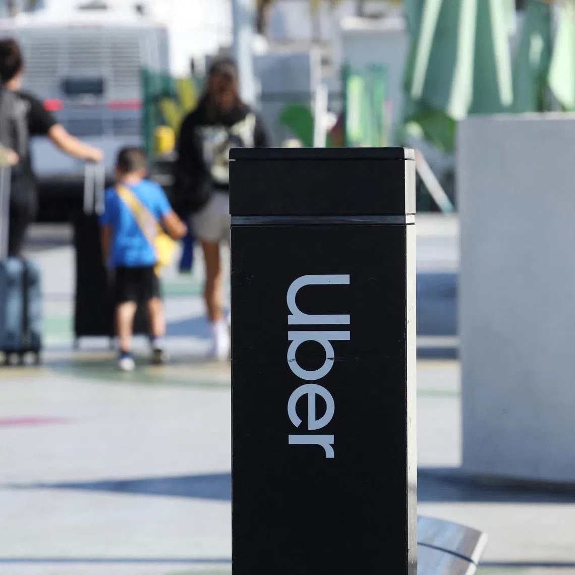 FILE PHOTO: Uber signage is posted at Los Angeles International Airport (LAX) in Los Angeles, California, U.S. July 10, 2022.  REUTERS/David Swanson/File Photo