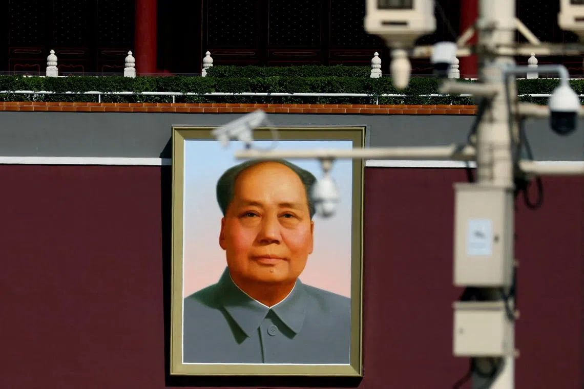 Surveillance cameras overlook Tiananmen Square in front of a portrait of late Chinese chairman Mao Zedong, in Beijing, China September 30, 2023. REUTERS/Florence Lo
