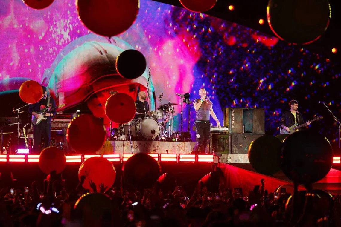 British band Coldplay light up National Stadium with kaleidoscopic concert | The Straits Times