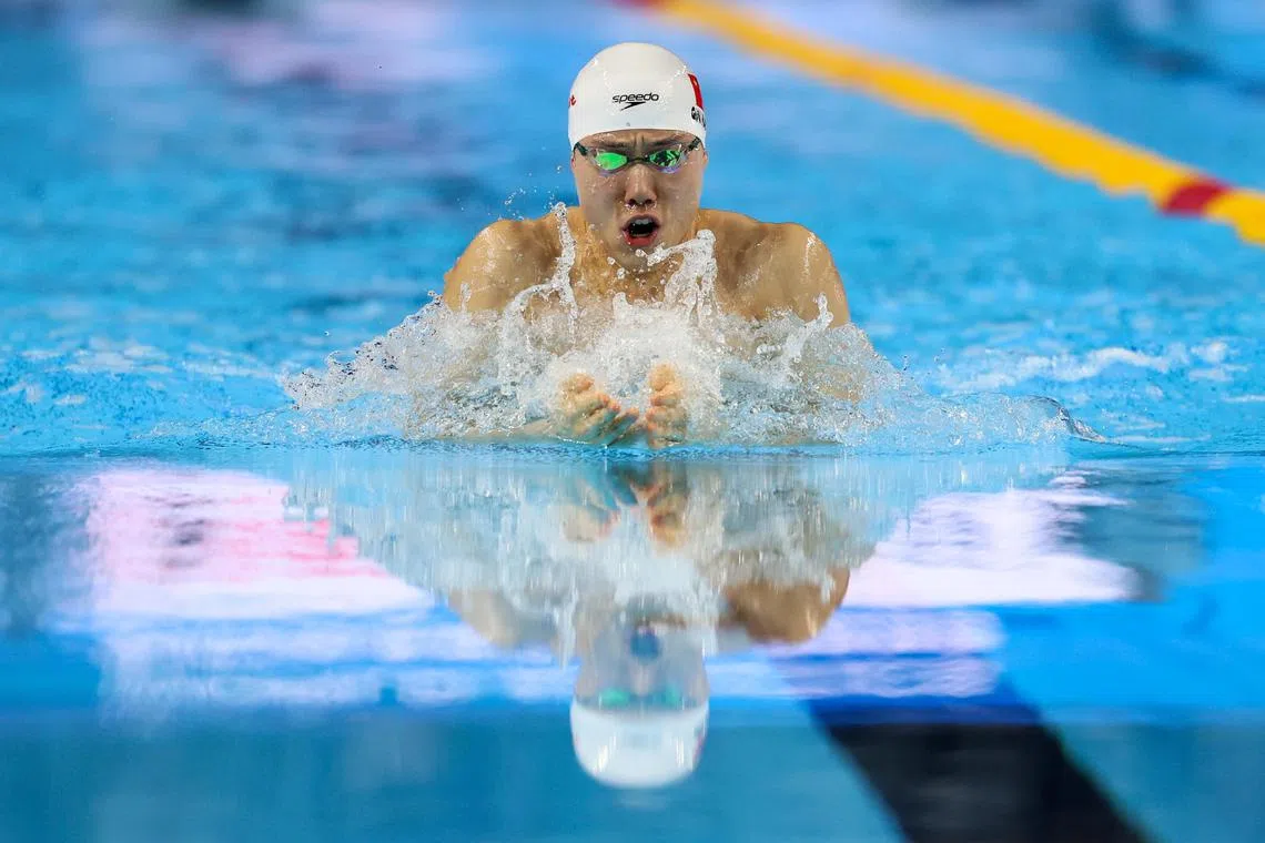 China's Qin Haiyang makes it back to the top of the World Aquatics Championships men's 100m breaststroke podium after a challenging 2024.