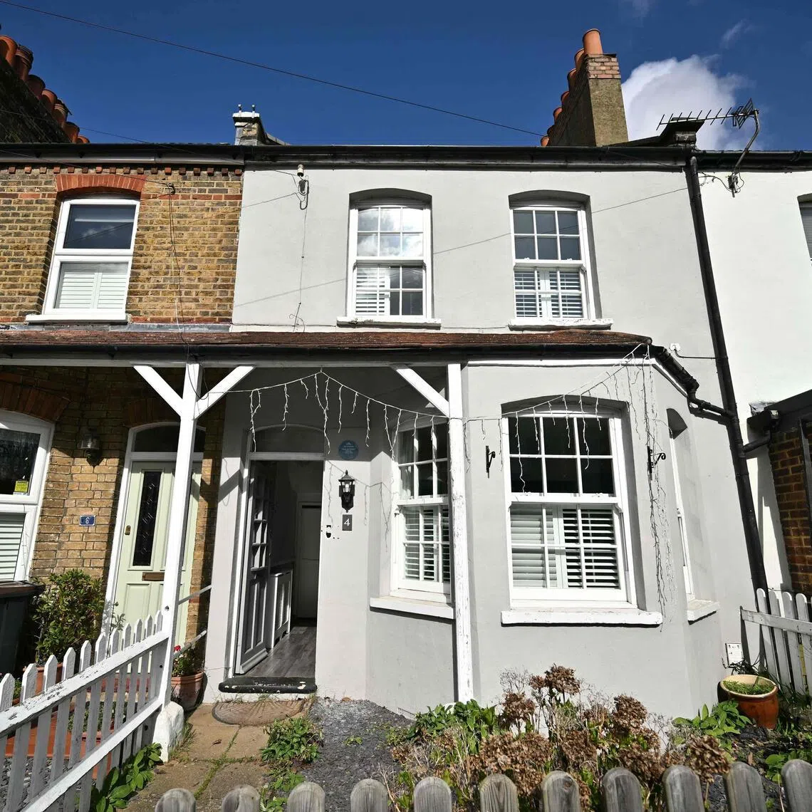 The former home of British singer David Bowie (C) is pictured in Bromley, south east of London, on March 11, 2026. No. 4 Plaistow Grove in the anonymous London suburb of Bromley is unremarkable in every way except for one. The modest terraced house, originally built as a railway workers' cottage in the late 19th century, is the childhood home of pop phenomenon David Bowie.
The house has been in private ownership for some 55 years but has now been acquired by a leading London heritage body which plans to turn it into a Bowie immersive experience. (Photo by Ben STANSALL / AFP) / TO GO WITH AFP STORY by Helen ROWE