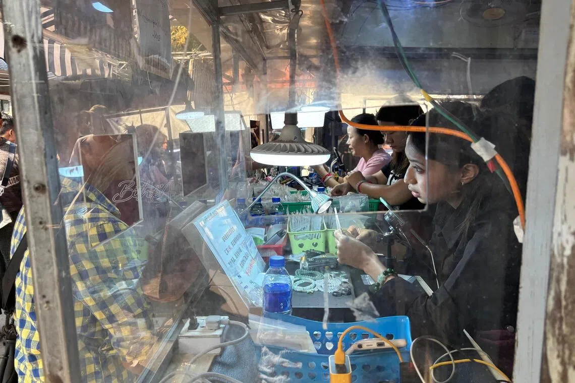 pwmyanmar - The bustling jade market in Mandalay is widely considered as the world's largest. Mandalay is a trading hub along Myanmar's main economic corridor with China. (Pic taken Jan 12) CREDIT: PHILIP WEN