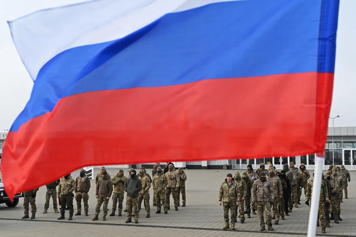 FILE PHOTO: Russian service members attend a ceremony to receive new vehicles and military equipment handed over by the Russian movement \"People's Front\" for the military involved in Russia-Ukraine conflict, in Rostov-on-Don, Russia February 23, 2025. REUTERS/Stringer/ FILE Photo