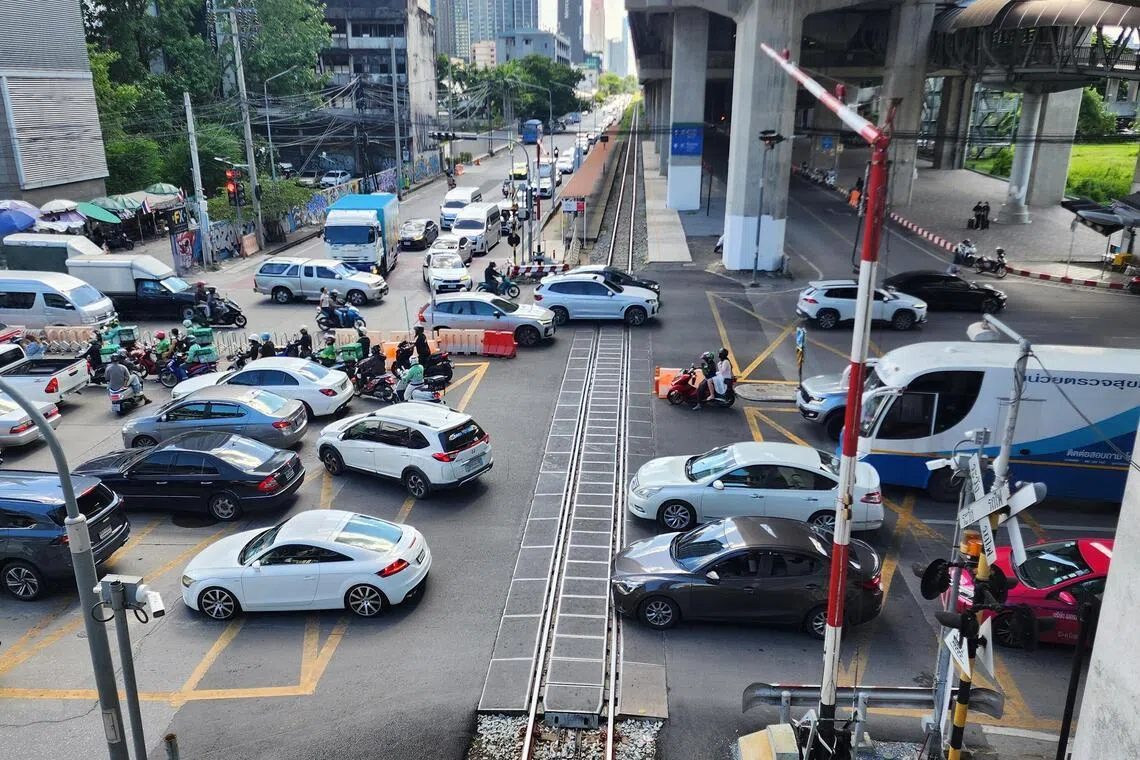 Traffic in central Bangkok near Makkasan Airport Rail Link station in Asoke-Din Daeng Road in Huai Khwang district on June 25, the site of a deadly train-vehicle crash in May.