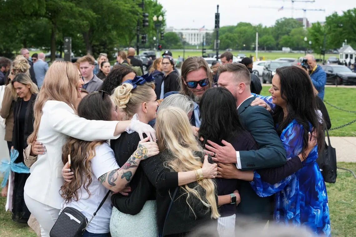 Virginia Giuffre's family during a "butterfly" vigil commemorating the one-year anniversary of her death. She was a victim of late financier and sex offender Jeffrey Epstein.
