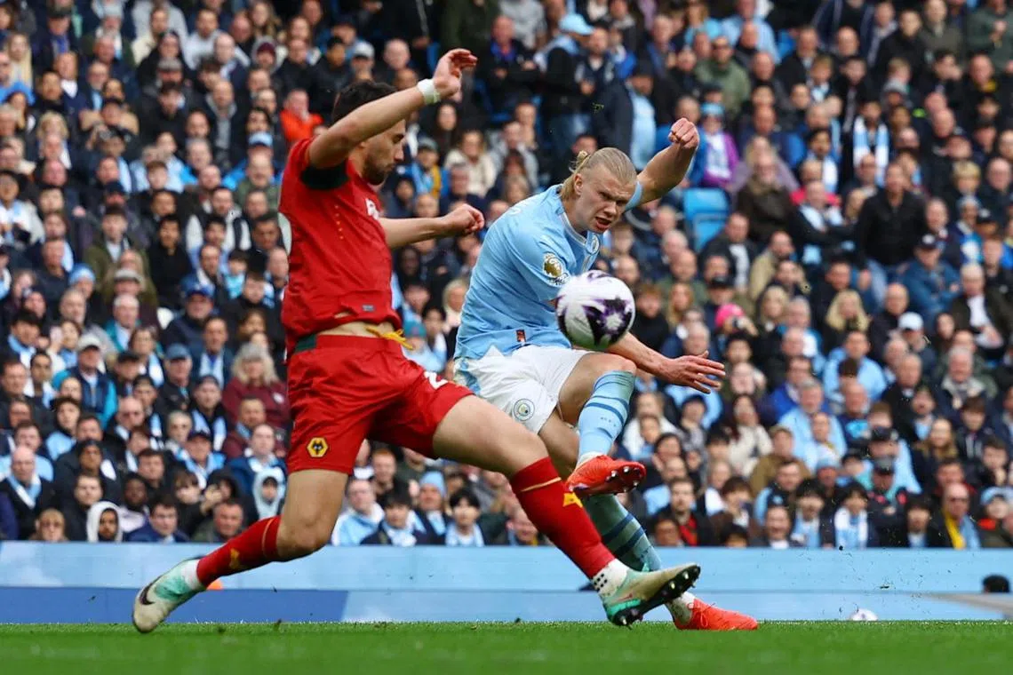 Erling Haaland scores Manchester City's fourth goal.