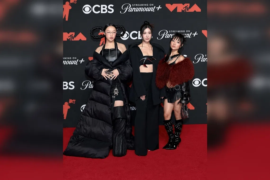 (From left) Audrey Nuna, Ejae an Rei Ami - who provide the singing voices of Huntrix from KPop Demon Hunters - attend the 2025 MTV Video Music Awards in New York on Sept 7. 