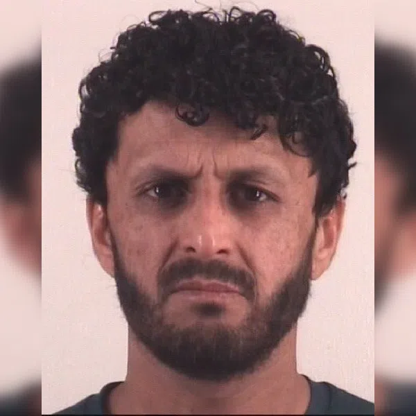 A mugshot of Mohammad Dawood Alokozay posted to the X account of Ms Tricia McLaughlin, Assistant Secretary in the US Department of Homeland Security.