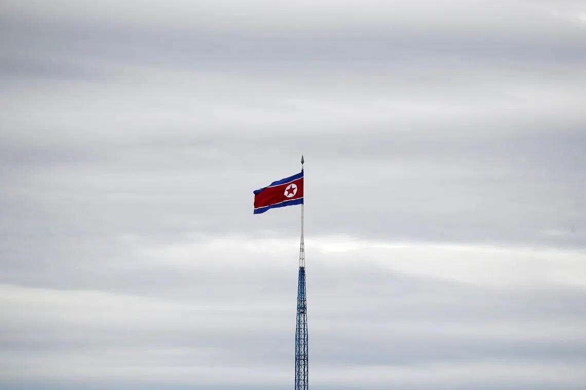 FILE PHOTO: A North Korean flag flutters on top of a 160-metre tower in North Korea's propaganda village of Gijungdong, in this picture taken from the Tae Sung freedom village near the Military Demarcation Line (MDL), inside the demilitarised zone separating the two Koreas, in Paju, South Korea, April 24, 2018. REUTERS/Kim Hong-Ji/File Photo