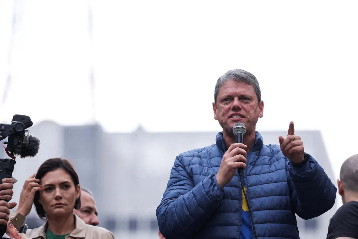 FILE PHOTO: Governor of Sao Paulo Tarcisio de Freitas speaks while Michelle Bolsonaro, wife of former Brazilian President Jair Bolsonaro stands near him, as supporters of former Brazilian President Jair Bolsonaro attend a demonstration on the Brazilian Independence Day, amid the final phase of Bolsonaro's trial, in which he is accused of plotting a coup after his electoral defeat, in Sao Paulo, Brazil September 7, 2025. REUTERS/Amanda Perobelli/File Photo
